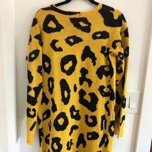 Yellow long sleeve cardigan with bold cheetah sign